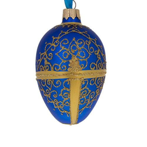 A blue handmade glass Christmas tree egg shaped pendant made in Faberge egg style with an artistic painting, embellished with glitter and beads, 2.6 inches