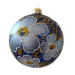 A blue handmade glass Christmas tree ball with gentle white flowers and embellished with golden glitter, 4 inches