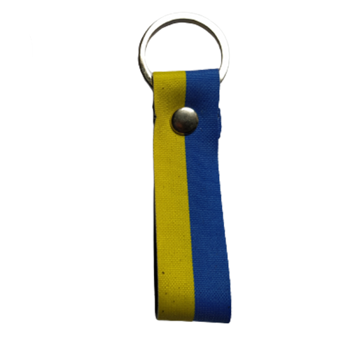 A leather keychain with a ribbon in the colours of the Ukrainian flag