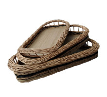 A set of oval trays made of wicker, with handles, L= 51 cm, 46 cm, 40 cm