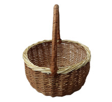 A brown basket made of wicker, with a high handle, d=20 cm, h=24 cm + handle