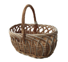 An oval brown basket made of wicker, with a round handle, L=44 cm, h=38 cm + handle