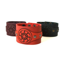 A wide leather bracelet with a traditional Slavic symbol "Sontsevorot"