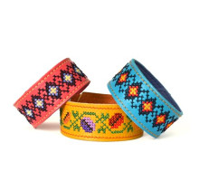 A women's leather bracelet embellished with a traditional Ukrainian embroidery