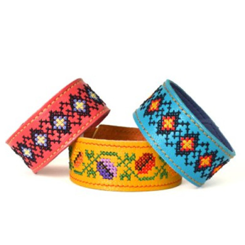 A women's leather bracelet embellished with a traditional Ukrainian embroidery