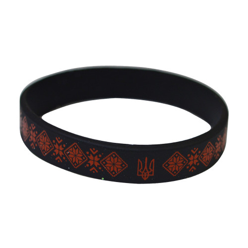 A silicone bracelet with Ukrainian ornament and coat of arms