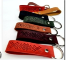 A leather keychain with a traditional Ukrainian ornament