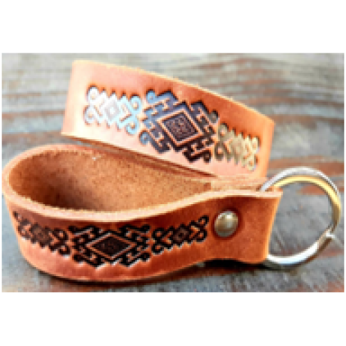 A leather keychain with a traditional Ukrainian ornament