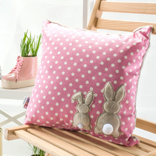 A pink decorative pillow with polka dots and embroidered hare, 43x43 cm