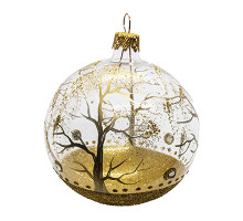 A transparent handmade glass Christmas tree ball with a golden landscape and embellished with golden glitter inside, 3.25 inches