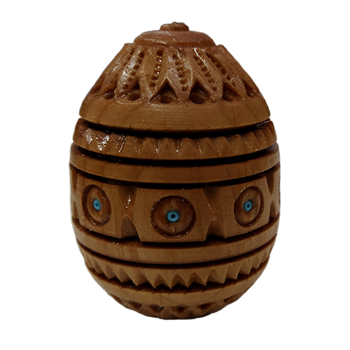 A carved wooden handmade pysanka embellished with beads, h=6.0 cm