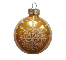 A golden handmade glass Christmas tree ball with a white depiction of a snowflake, embellished with pearls, 3,25 inches