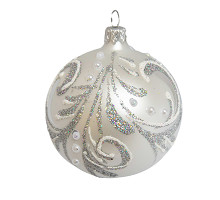 A silver handmade glass Christmas tree ball with a silver floral ornament, 3,25 inches