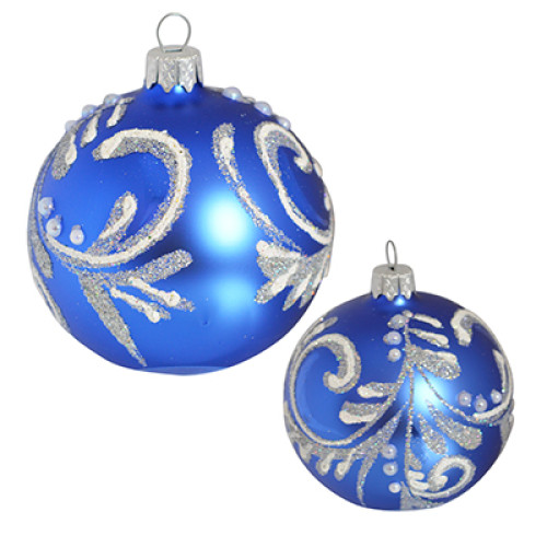 A blue handmade glass Christmas tree ball with a silver floral ornament, 3,25 inches