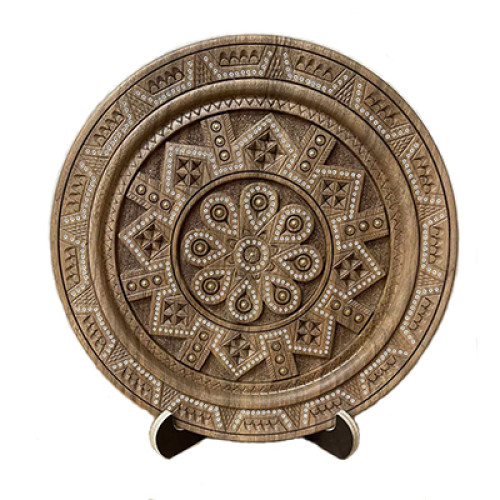 A carved wooden decorative plate with a traditional Hutsul ornament, 8,6-10 inches