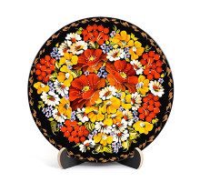 A wooden decorative plate with bright yellow and orange flowers made in Petrykivskyi painting technique, 9 inches
