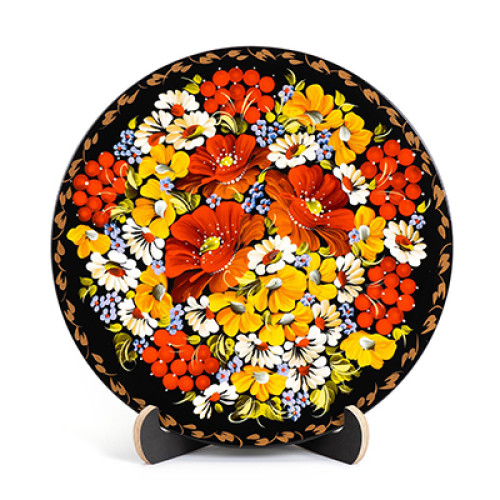 A wooden decorative plate with bright yellow and orange flowers made in Petrykivskyi painting technique, 9 inches
