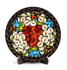A wooden decorative plate with poppy flowers and camomiles made in Petrykivskyi painting technique, 9 inches