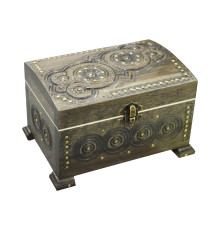 A carved handmade wooden casket, decorated with metal insertions,