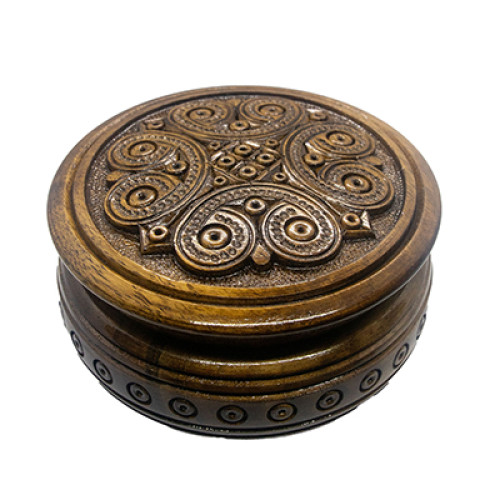 A carved handmade wooden rakva-casket, encrusted with beads,