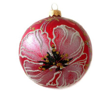 A red handmade glass Christmas tree ball with gentle white flowers and embellished with golden glitter, 4 inches