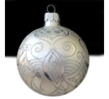 A silver handmade glass Christmas tree ball with a silver flower ornament, embellished with glitter, 3,25 inches