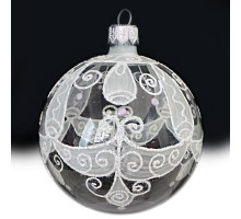 A transparent handmade glass Christmas tree ball with a white tracery, embellished with glitter, 4 inches