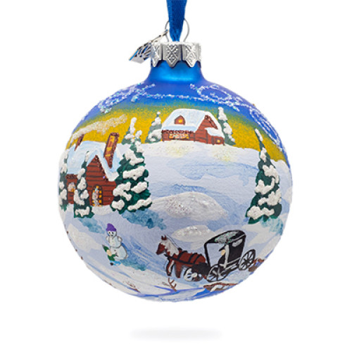 A blue handmade glass Christmas tree ball with an artistic painting, embellished with glitter "A winter landscape", 3.25 inches