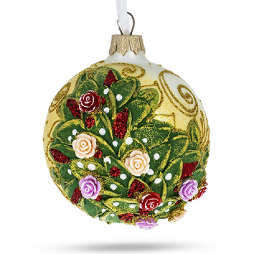 A white handmade glass Christmas tree ball with a relief painting of a bouquet of roses, embellished with glitter, 3,25 inches