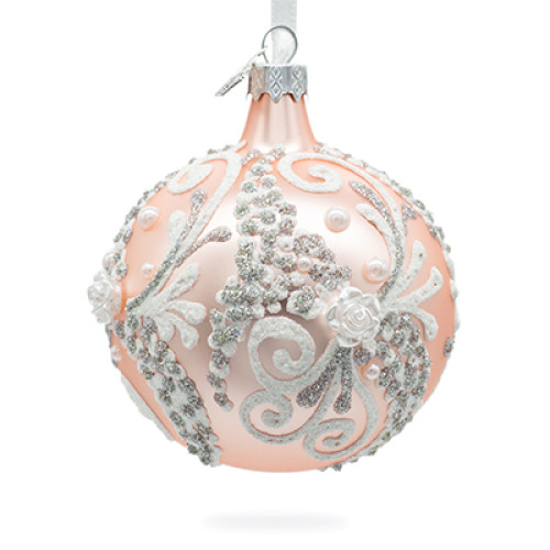 A pale pink handmade glass Christmas tree ball with a floral ornament, embellished with 3D flowers and glitter, 3,25 inches