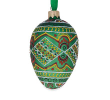 A green handmade glass Christmas tree egg shaped pendant with a geometrical Ukrainian ornament, embellished with glitter, 2.6 inches