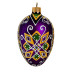 A green and purple handmade glass Christmas tree egg shaped pendant with a geometrical ornament, embellished with glitter, 2.6 inches