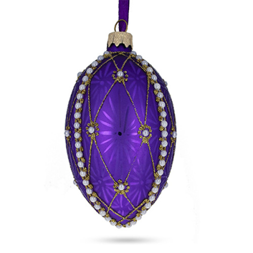 A purple handmade glass Christmas tree egg shaped pendant with a geometrical ornament, embellished with glitter "Pearls", 2.6 inches