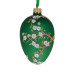 A green handmade glass Christmas tree egg shaped pendant with an artistic painting, embellished with glitter "An apple blossom", 2.6 inches