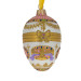 A white handmade glass Christmas tree egg shaped pendant made in Faberge egg style with an artistic painting, embellished with glitter and beads "A bonbonniere", 2.6 inches
