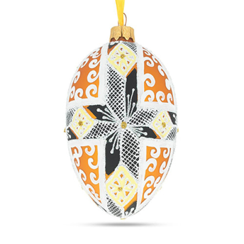 A white handmade glass Christmas tree egg shaped pendant with a Ukrainian traditional ornament, embellished with glitter "A snowflake", 2.6 inches