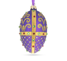 A purple handmade glass Christmas tree egg shaped pendant with a royal ornament, embellished with glitter and beads, 2.6 inches