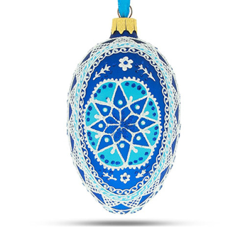 A sky-blue handmade glass Christmas tree egg shaped pendant with a Ukrainian traditional ornament "A star", 2.6 inches