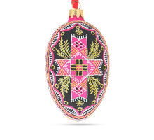 A pink handmade glass Christmas tree egg shaped pendant with a Ukrainian traditional ornament "A cross", 2.6 inches