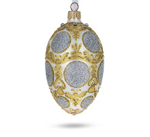 A silver handmade glass Christmas tree egg shaped pendant made in Faberge egg style with an artistic painting, embellished with glitter and rhinestones, 2.6 inches
