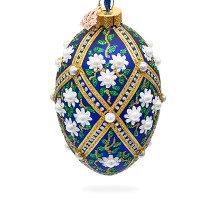 A blue handmade glass Christmas tree egg shaped pendant with a traditional ornament, embellished with glitter and pearls "White flowers", 2.6 inches