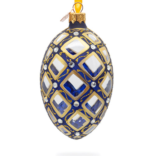 A blue handmade glass Christmas tree egg shaped pendant with a mosaic tracery, embellished with glitter, pearls and mirroring insertions, 2.6 inches
