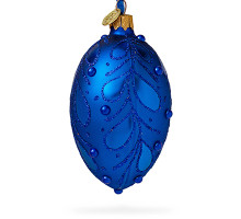 A blue handmade glass Christmas tree egg shaped pendant with a floral ornament, embellished with glitter and pearls, 2.6 inches