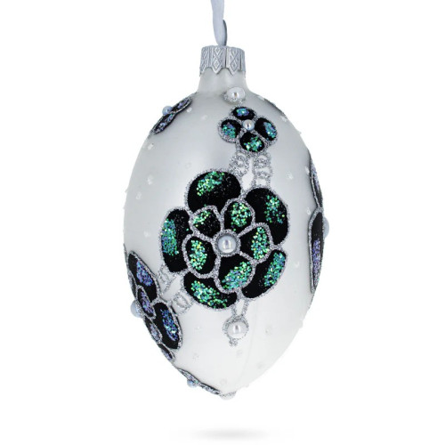 A silver handmade glass Christmas tree egg shaped pendant with voluminous velour flowers, embellished with pearls and glitter, 2,6 inches