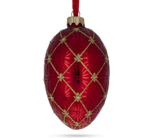 A red handmade glass Christmas tree egg shaped pendant made in Faberge egg style with an artistic painting, embellished with glitter "A coronation", 2.6 inches