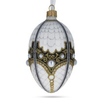 A white handmade glass Christmas tree egg shaped pendant with a traditional ornament, embellished with glitter and pearls, 2.6 inches