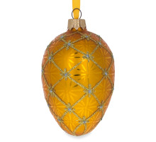 A golden handmade glass Christmas tree egg shaped pendant made in Faberge egg style with an artistic painting "A coronation", 2.6 inches