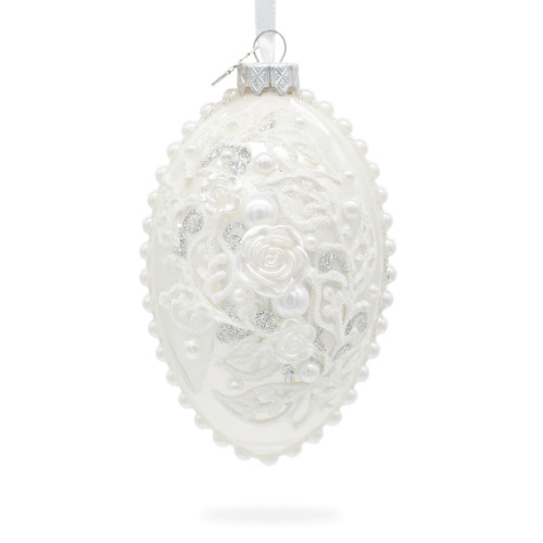 A white handmade glass Christmas tree egg shaped pendant with a gentle ornament, embellished with glitter, pearls and 3D flowers, 2.6 inches
