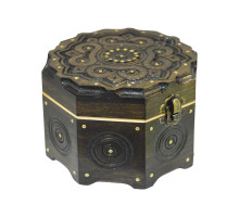 A handmade octahedral wooden casket, decorated with metal elements,